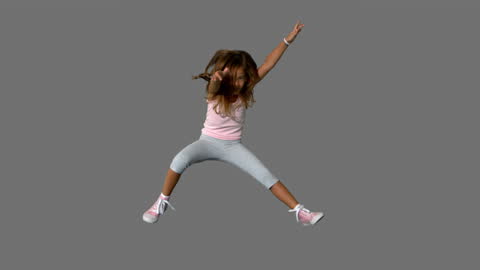 Energetic Girl Jumping with Freedom and Joy