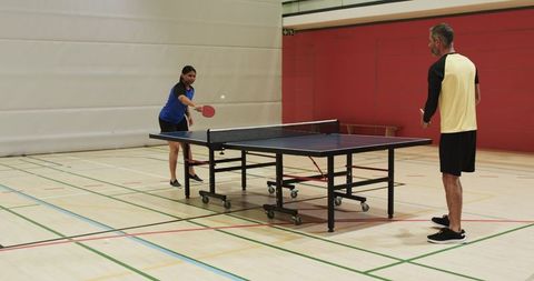 Athletic Partners Training Ping Pong in Sports Hall