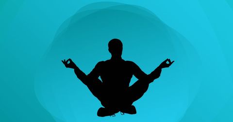 Silhouette of Man Meditating Against Tranquil Blue Background - Download Free Stock Images Pikwizard.com