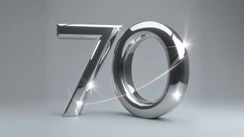 Cinematic Chrome 70 Rotating with Light Sweep and Starburst Flares for Anniversary