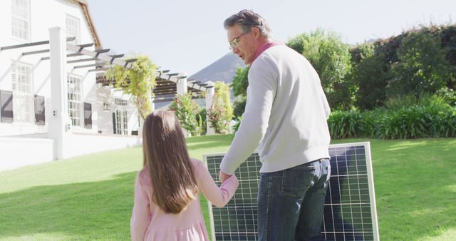 Father and Daughter Installing Solar Panels in Garden on Sunny Day - Download Free Stock Images Pikwizard.com