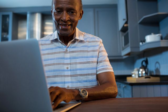 Portrait of senior man using laptop - Download Free Stock Photos Pikwizard.com