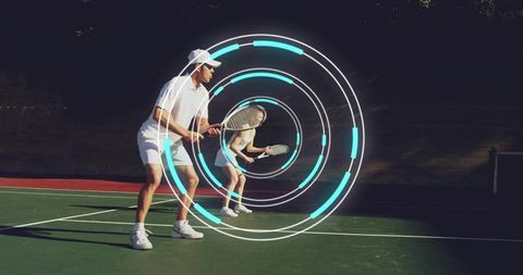 Tennis doubles partners practicing on sunlit hard court with futuristic cyan target rings