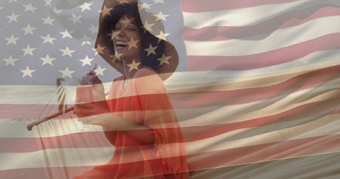 Smiling woman sipping beach cocktail with american flag overlay summer celebration