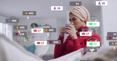 Sipping coffee while surrounded by social media notifications in modern cozy living room