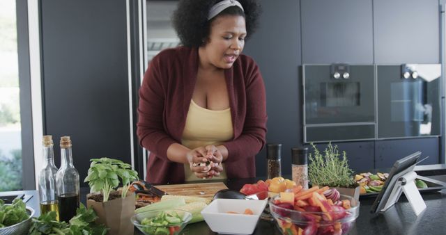 Woman Cooking Healthy Meal in Modern Kitchen Using Tablet for Recipe - Download Free Stock Images Pikwizard.com