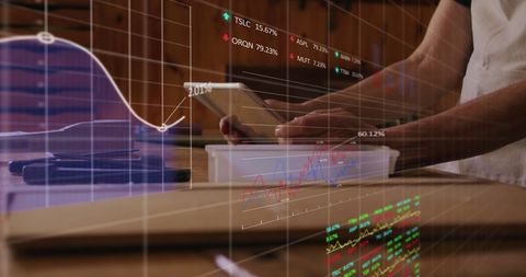 Man Analyzing Financial Data on Digital Tablet Overlay