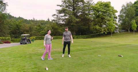 Friends Enjoying Golf Day Outdoor in Scenic Nature