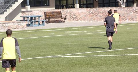 Soccer Practice on Field with Teamwork and Skill Development