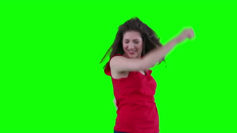 Joyful Woman Dancing with Enthusiasm on Vibrant Green Background
