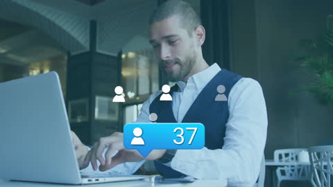 Businessman Networking Online Using Laptop in Modern Workspace