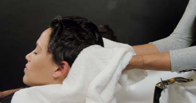 Woman Receiving Relaxing Hair Wash at Salon - Download Free Stock Images Pikwizard.com