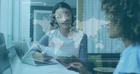 Professional Women Analyzing Global Data During a Business Meeting