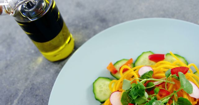 Healthy Vegetable Salad Plate with Olive Oil on Grey Table - Download Free Stock Images Pikwizard.com