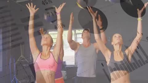 Group performing synchronized med ball overhead throws with fitness data charts overlay