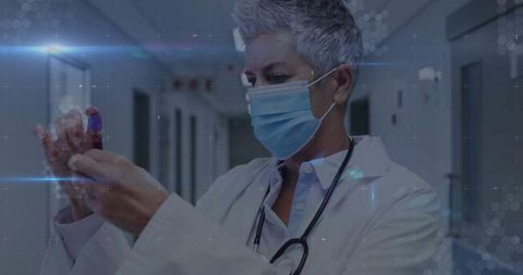 Senior doctor conducting laboratory work with blood sample