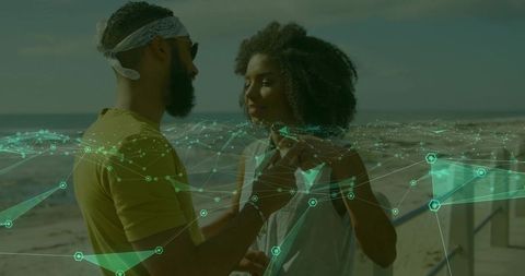 Couple Enjoying Sunny Day on Scenic Beach with Network Icon Overlay