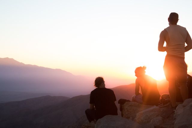 Group of Friends Watching Sunset on Mountain Top - Download Free Stock Photos Pikwizard.com