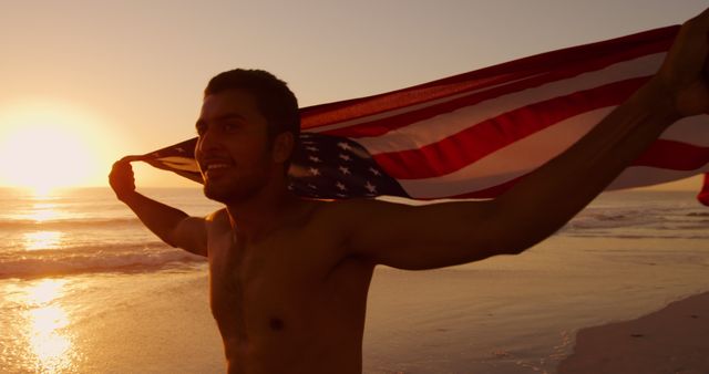 Man Enjoying Sunset at Beach with American Flag - Download Free Stock Images Pikwizard.com