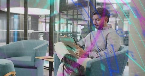 Modern Professional Exploring Digital Tablet in Corporate Lounge