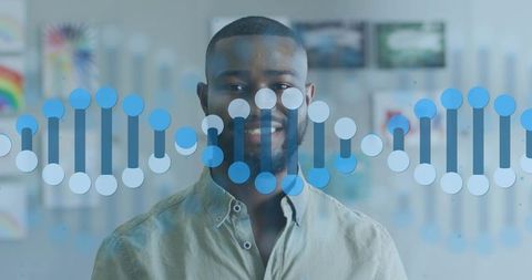 Smiling professional presenting blue DNA helix overlay in workspace for genomics visualization