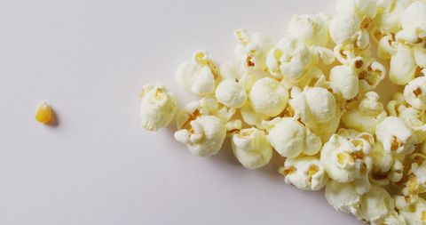 Minimalist Popcorn and Kernel on White Background - Download Free Stock Images Pikwizard.com
