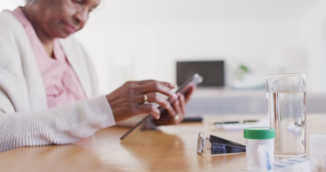 Senior Woman Managing Medications with Smartphone at Home - Download Free Stock Images Pikwizard.com