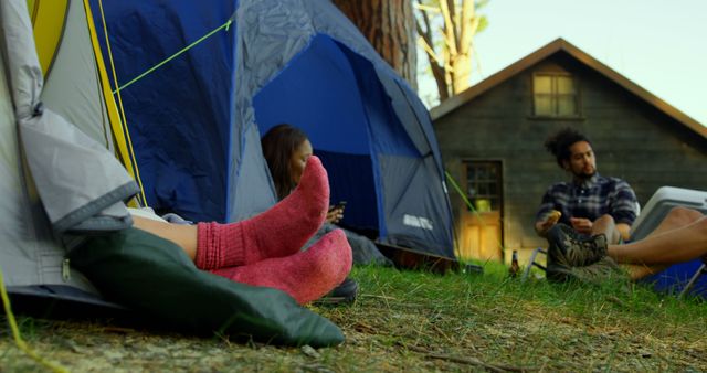 Camping Getaway with Friends Relaxing by Tents in Forest - Download Free Stock Images Pikwizard.com