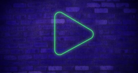 Neon green play button glowing on dark brick wall background