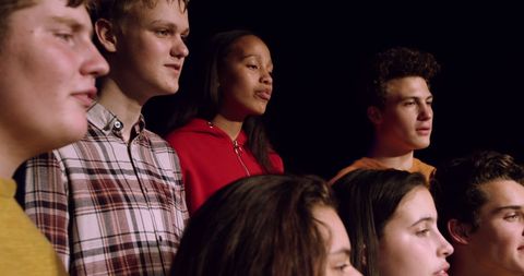 Diverse Teenage Choir Performing on Stage