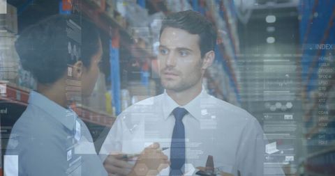 Business professionals analyzing data in warehouse