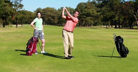 Amateur Golfers Playing Together on Sunny Golf Course - Download Free Stock Images Pikwizard.com