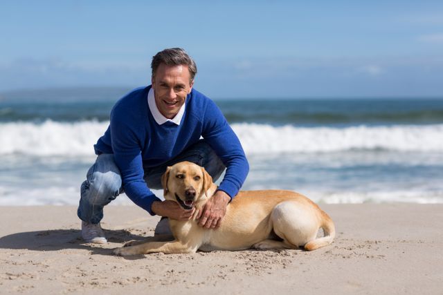 Portrait of mature man with his dog on the beach
