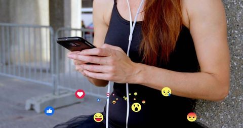 Tech-Savvy Woman Communicates Using Social Media Over Smartphone