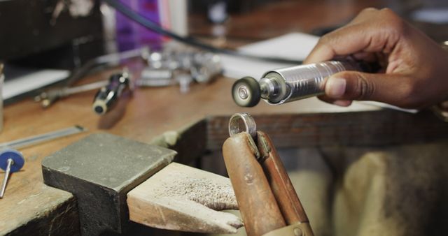 Jewelry Maker Polishing Ring in Workshop - Download Free Stock Images Pikwizard.com