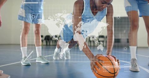 Youth basketball player leaning with ball on gym court with global data grid overlay