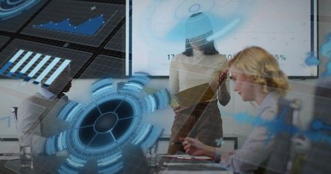 Female leader presenting analytics and charts while pointing at display, holding tablet