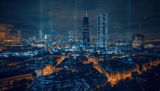Futuristic Neon Blue Night Cityscape Showing Skyscrapers with LED Lines and Reflections