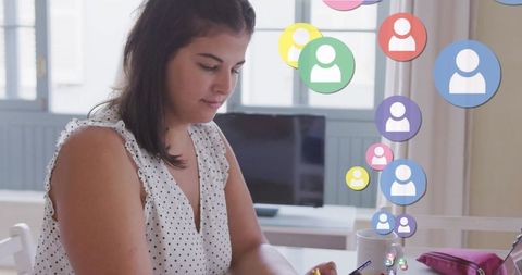 Woman Using Smartphone for Social Media Networking at Home Desk