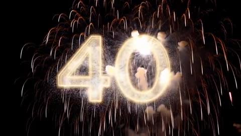 Golden 40 Fireworks Exploding with Falling Embers and Smoky Halo for Anniversary