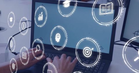 Typing hands using laptop with holographic education and analytics icons for e-learning