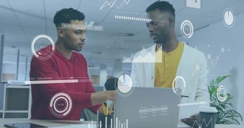 Discussing data visualization on laptop with HUD overlay, pointing and collaborating