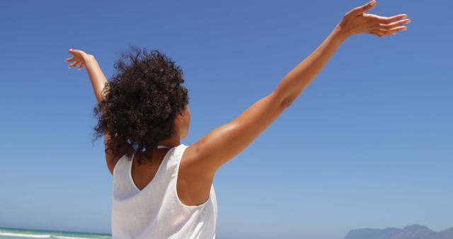 Joyful Woman with Open Arms on Sunny Beach - Download Free Stock Images Pikwizard.com