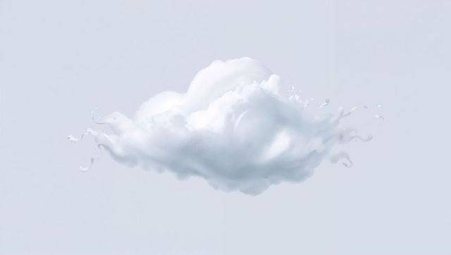 Soft white cumulus cloud floating on pale blue background with delicate mist and droplets