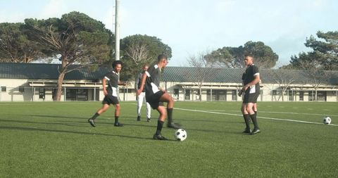 Youth Soccer Training Session with Coach Guiding Young Players