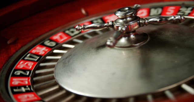 Close-up of spinning roulette wheel on poker table in casino  - Download Free Stock Photos Pikwizard.com