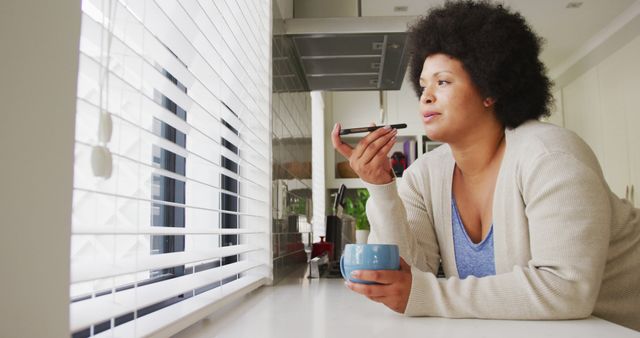 Thoughtful Woman with Coffee Using Smartphone Voice Control - Download Free Stock Images Pikwizard.com