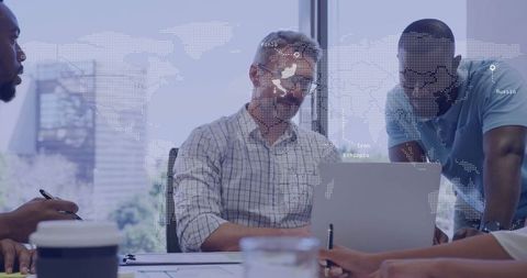 Collaborating Colleagues Analyzing Data in Office with World Map Overlay