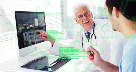 Senior doctor mentoring junior in molecular biology at clinic