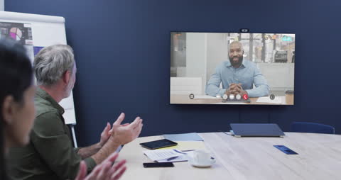 Diverse Team Engaged in Video Call Meeting with Colleague